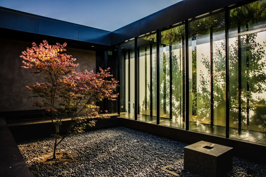 brown-black-wooden-bench-near-glass-window